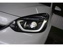 フィット ｅ：ＨＥＶホーム　４ＷＤ／ワンオーナー／純正９インチナビＴＶ／バックカメラ／コーナーセンサー／ＬＥＤライト／レーダークルーズ／ミラーヒーター／横滑り防止／スマートキー／プッシュスタート／ＵＳＢポート／ライトレベライザー（7枚目）