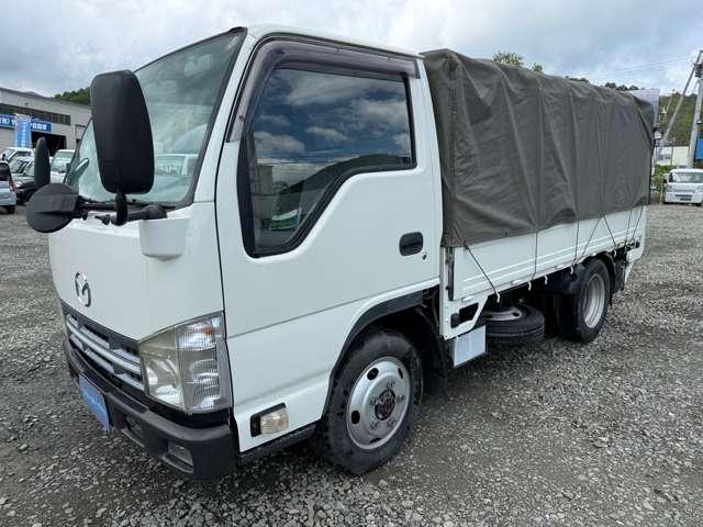 タイタントラック フルワイドロー　４ＷＤ　インタークラーラーターボディーゼル　スムーサＥＸ　１．５ｔ積　アーム式パワーゲート付　幌車　キーレス　４ナンバー　シャーシー塗装　スタッドレスタイヤ（ホイール付）付（2枚目）