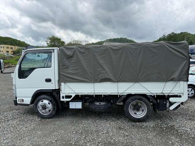 タイタントラック フルワイドロー　４ＷＤ　インタークラーラーターボディーゼル　スムーサＥＸ　１．５ｔ積　アーム式パワーゲート付　幌車　キーレス　４ナンバー　シャーシー塗装　スタッドレスタイヤ（ホイール付）付（4枚目）