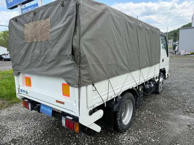 タイタントラック フルワイドロー　４ＷＤ　インタークラーラーターボディーゼル　スムーサＥＸ　１．５ｔ積　アーム式パワーゲート付　幌車　キーレス　４ナンバー　シャーシー塗装　スタッドレスタイヤ（ホイール付）付（5枚目）