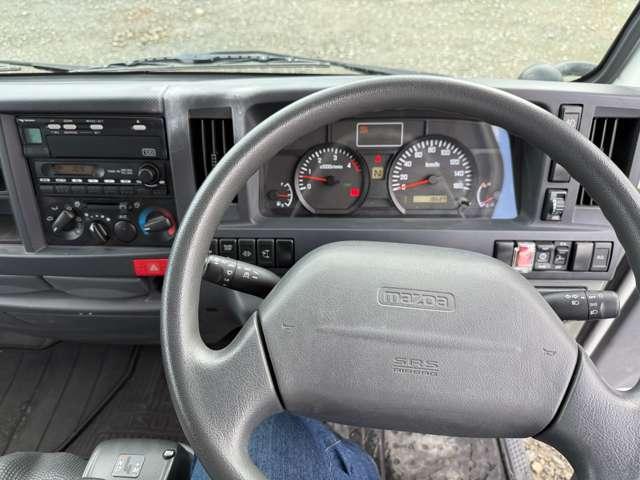 タイタントラック フルワイドロー　４ＷＤ　インタークラーラーターボディーゼル　スムーサＥＸ　１．５ｔ積　アーム式パワーゲート付　幌車　キーレス　４ナンバー　シャーシー塗装　スタッドレスタイヤ（ホイール付）付（11枚目）