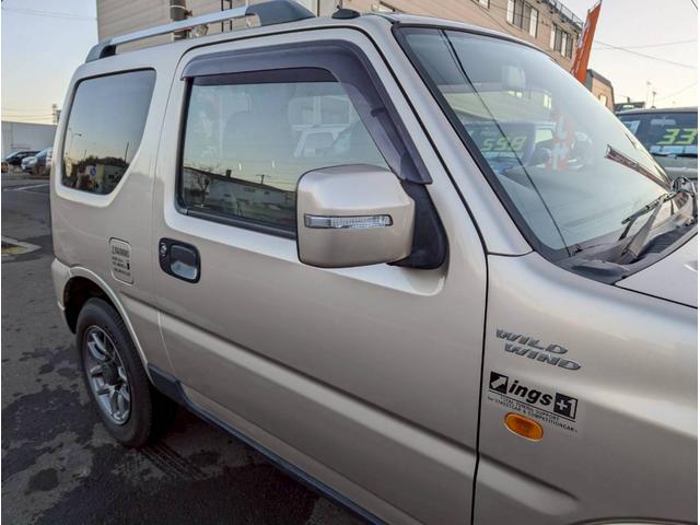 ジムニー ワイルドウインド AT車 社外テール ナビ フォグランプ ハーフレザーシート ドアサイドバイザー 電動格納ミラー ルーフレール スペアタイヤカバー(19枚目)