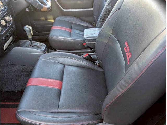 ジムニー ワイルドウインド AT車 社外テール ナビ フォグランプ ハーフレザーシート ドアサイドバイザー 電動格納ミラー ルーフレール スペアタイヤカバー(51枚目)