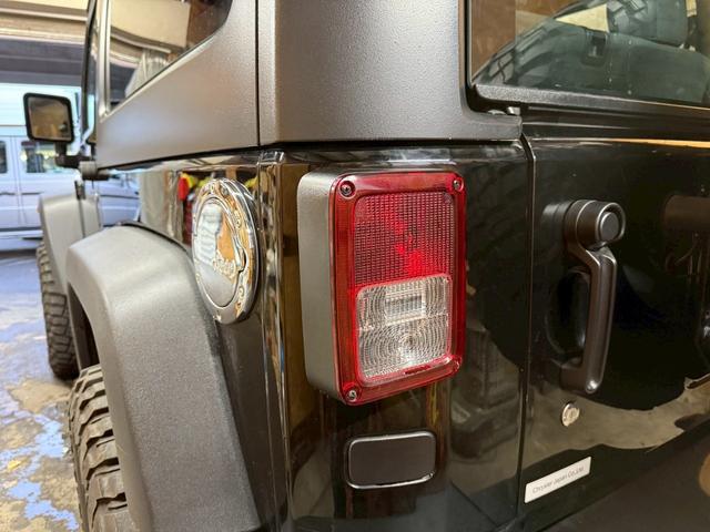 ジープ・ラングラー スポーツ 4WD ETC オートクルーズコントロール サンルーフ アルミホイール AT 盗難防止システム Bluetooth ABS エアコン パワーウィンドウ 運転席エアバッグ 助手席エアバッグ(50枚目)