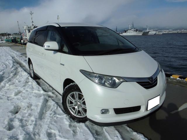 エスティマハイブリッド Ｇ　４ＷＤ　ワンオーナー　往年整備記録簿全て有り　両側ＰＷスライドドア　純正ナビ　Ｂカメラ　後席モニター　ドラレコ　クルコン　ＥＴＣ　寒冷地仕様　近畿地方仕入れサビ無し（4枚目）