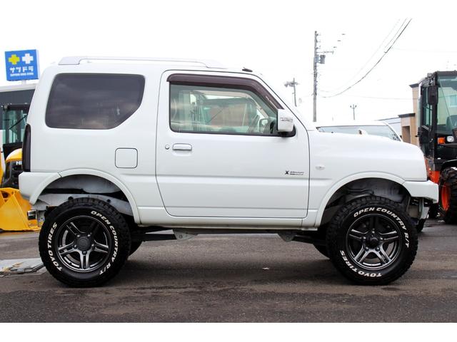 ジムニー クロスアドベンチャーXA 9型 タニグチ3inリフトアップ APIOマフラー 新品LEDヘッドライト 新品LEDテール TOYOオプカンRT 社外ナビ フルセグ シートヒーター(24枚目)