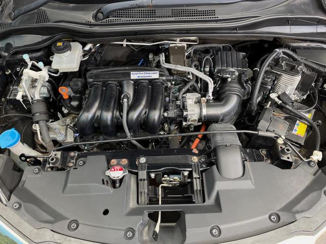 ヴェゼル ハイブリッドＸ・ホンダセンシング　４ＷＤ　禁煙車　ホンダセンシング　純正ナビ　寒冷地仕様　アダプティブクルーズコントロール　シートヒーター　ＥＴＣ　バックカメラ　純正１６インチアルミホイール　純正革巻きステアリング（18枚目）