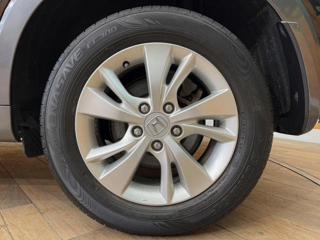 ヴェゼル ハイブリッドＸ・ホンダセンシング　４ＷＤ　禁煙車　ホンダセンシング　純正ナビ　寒冷地仕様　アダプティブクルーズコントロール　シートヒーター　ＥＴＣ　バックカメラ　純正１６インチアルミホイール　純正革巻きステアリング（65枚目）