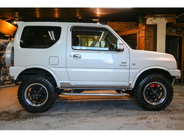 ジムニー クロスアドベンチャー ショックアブソーバー(タニグチ) サイドステップバー マフラー(タニグチ) タンクカバー(タニグチ) Defiメーター RAYS16インチホイール ヨコハマジオランダーMT(7枚目)