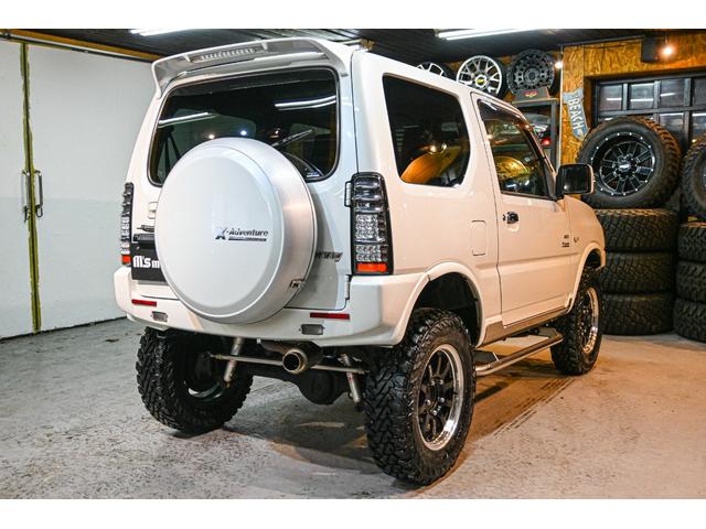 ジムニー クロスアドベンチャー ショックアブソーバー(タニグチ) サイドステップバー マフラー(タニグチ) タンクカバー(タニグチ) Defiメーター RAYS16インチホイール ヨコハマジオランダーMT(10枚目)