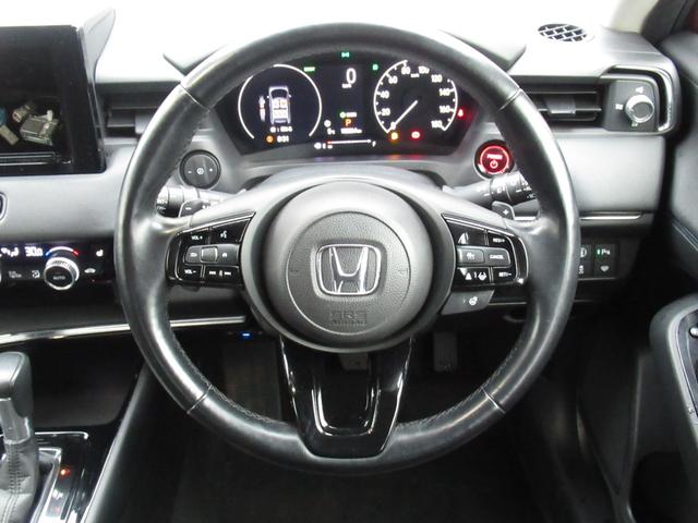 ヴェゼル ｅ：ＨＥＶＺ　純正ＥＴＣ付・純正エンジンスタータ・オーディオレス・運転席助手席シートヒーター・パワーテールゲート・ブラインドスポットインフォメーション・親水／ヒーテッドドアミラー＋熱線入りフロントウインドウ（21枚目）