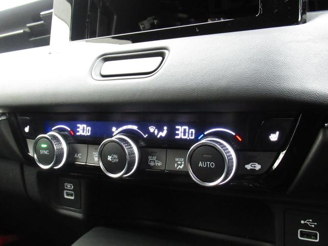 ヴェゼル ｅ：ＨＥＶＺ　純正ＥＴＣ付・純正エンジンスタータ・オーディオレス・運転席助手席シートヒーター・パワーテールゲート・ブラインドスポットインフォメーション・親水／ヒーテッドドアミラー＋熱線入りフロントウインドウ（34枚目）