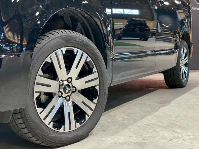 デリカＤ：５ Ｐ　４ＷＤ　ＭＤＦベッドキット　ヴァレンティＬＥＤテール　純正カーテン　ＪＡＯＳリアスポイラー　両側パワースライドドア　ＫＥＮＷＯＯＤＳＤナビ　前席シートヒーター　電動リアゲート　Ｄ席パワーシート（12枚目）