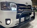 ハイエースバン スーパーGL ダークプライム 4WD フロントブッシュバー JAOSオーバーフェンダー ウシャリン16インチホイール オープンカントリーR/Tタイヤ インテリアパネルキット ベッドキット 両側パワースライドドア ストラーダSDナビ 中古車画像_4
