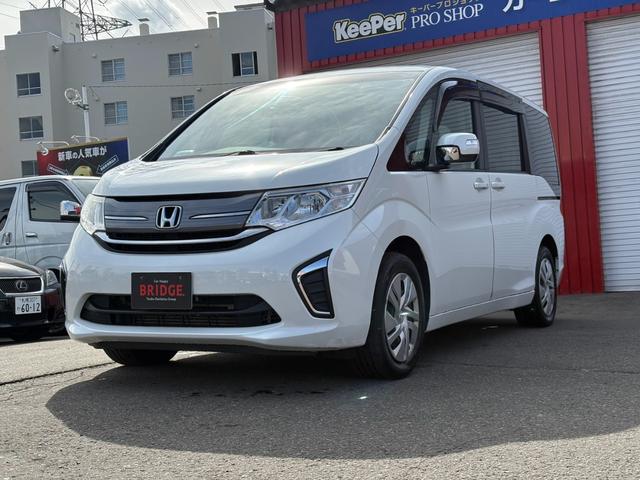 ステップワゴン Ｇ　４ＷＤ／パワースライドドア／純正ナビ／フルセグＴＶ／バックカメラ／フリップダウンモニター／純正エンジンスターター／ＥＴＣ／ワイパーデアイサー／ミラーヒーター／クルーズコントロール／後席エアコン（2枚目）
