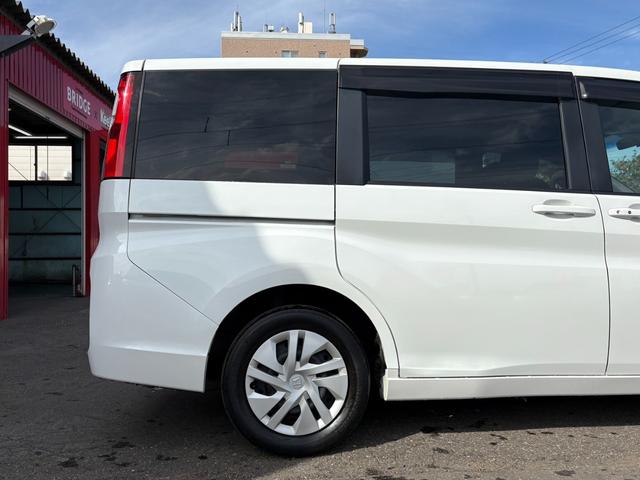 ステップワゴン Ｇ　４ＷＤ／パワースライドドア／純正ナビ／フルセグＴＶ／バックカメラ／フリップダウンモニター／純正エンジンスターター／ＥＴＣ／ワイパーデアイサー／ミラーヒーター／クルーズコントロール／後席エアコン（9枚目）