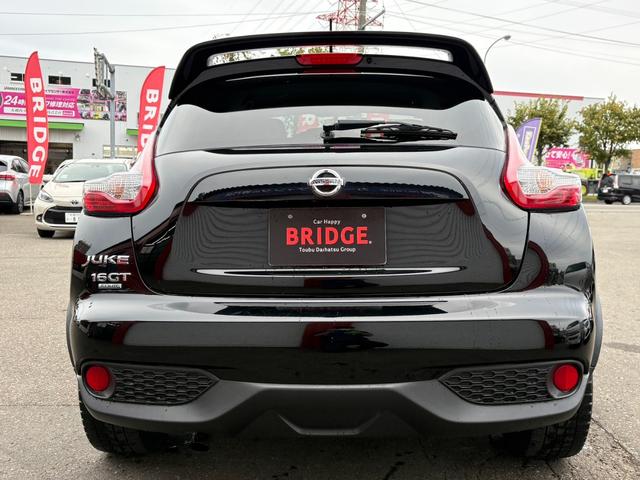 ジューク １６ＧＴ　ＦＯＵＲ　１オーナー／純正フルセグナビ／全方位カメラ／ＥＴＣ／パートタイム４ＷＤ／ターボ／純正アルミホイール／ＭＴモード付シフトレバー／ＡＢＳ／ＡＡＣ／フルフラットシート／オートライト／フォグランプ（7枚目）