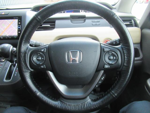 フリード Ｇ・ホンダセンシング　４ＷＤ　ＡＢＳ　プッシュスタート　キーフリー　ナビ・ＴＶ　バックモニター　シートヒーター　ステアリングスイッチ　クルーズコントロール　ＥＴＣ　両側パワースライドドア　ＥＳＣ　夏タイヤ積込（23枚目）