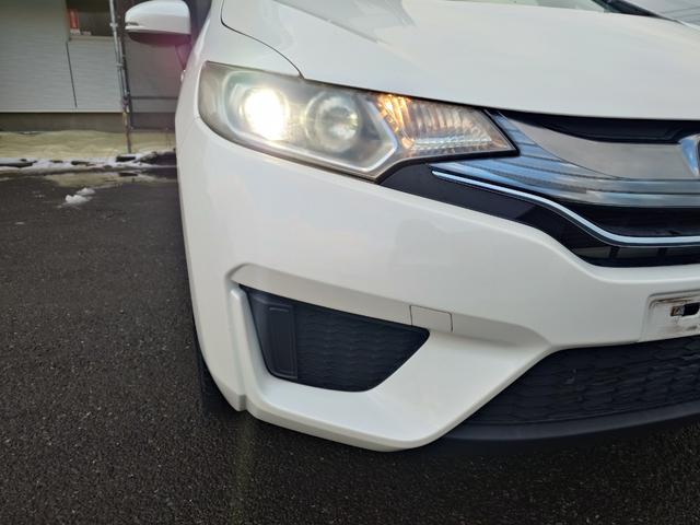 フィットハイブリッド Ｌパッケージ　４ＷＤ　メモリーナビ　ワンセグＴＶ　スマートキー　衝突軽減ブレーキ　Ｂｌｕｅｔｏｏｔｈ　クルコン　純正１５インチ鉄　ＥＴＣ（15枚目）