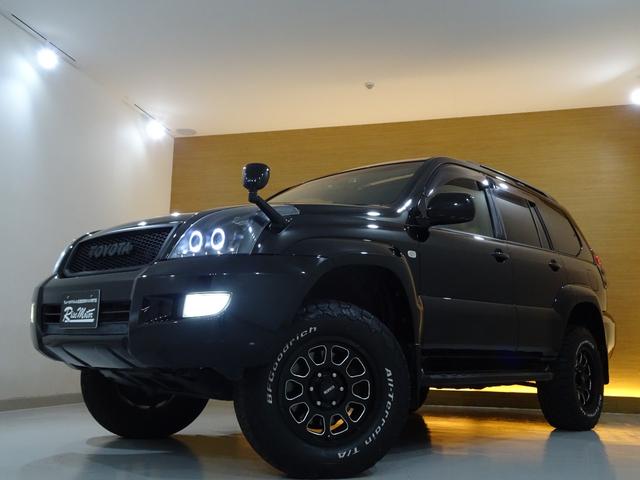 ランドクルーザープラド ＴＸリミテッド　４ＷＤ／本州仕入／寒冷地仕様／後期型／８人乗／新革調シートカバー／サンルーフ／リフトアップ／メッシュグリル＆ＴＯＹＯＴＡエンブレム／ＢＦグッドリッチ／社外テール／インナーブラックイカリング付きＨライト（23枚目）