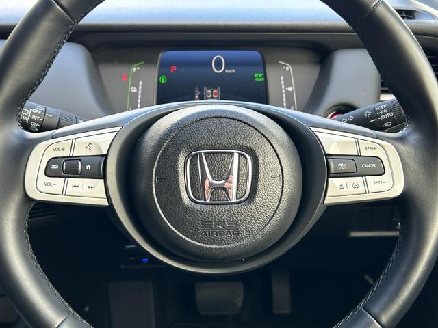 フィット e:HEVホーム 当社試乗車 純正9インチナビ 夏冬タイヤ付 ドラレコ TVフル リアカメラ ETC(12枚目)
