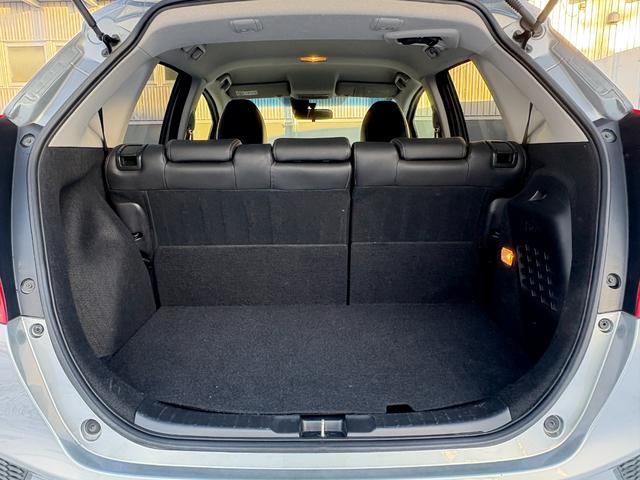 フィットハイブリッド Lパッケージ 4WD 純正ナビ Bluetoothオーディオ 地デジ バックカメラ 純正スターター ハーフレザー ワンオーナー車 走行7.5万km 車検R10年2月 夏冬タイヤセット(26枚目)