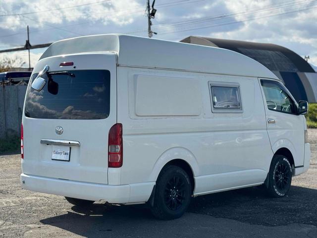 ハイエースワゴン 　４ＷＤ　キャンピングカー　ＥＴＣ　バックカメラ　ナビ　ＴＶ　スライドドア　アルミホイール　ＡＴ　エアコン　パワーウィンドウ　ベバストＦＦヒーター　サブバッテリー　電子レンジ　コンロ　シンク　テーブル（5枚目）