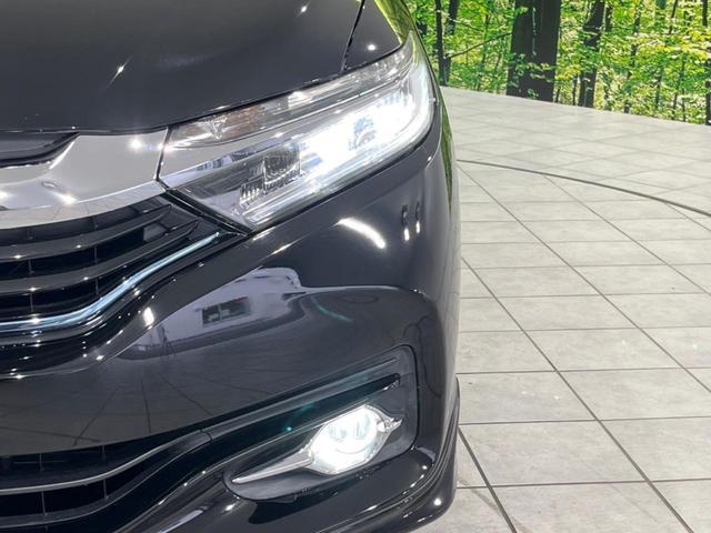 シャトル ハイブリッドXスタイルエディション SDナビ バックカメラ 寒冷地仕様 シティブレーキアクティブシステム 禁煙車 ハーフレザーシート スマートキー LEDヘッド ビルトインETC クルコン オートライト オートエアコン 横滑り防止装置(13枚目)