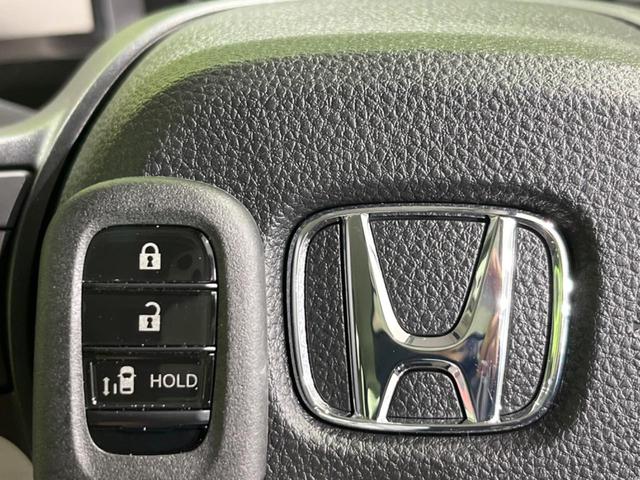 Ｎ－ＢＯＸ ベースグレード　４ＷＤ　届出済未使用車　ホンダセンシング　電動スライドドア　レーダークルーズ　前席シートヒーター　パーキングセンサー　スマートキー　ＬＥＤヘッド　オートライト　オートエアコン　横滑り防止装置（7枚目）