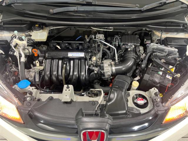 フィットハイブリッド Lパッケージ SDナビ バックカメラ 寒冷地仕様 衝突被害軽減システム 禁煙車 ハーフレザーシート ドラレコ スマートキー LEDヘッド ETC クルコン オートライト オートエアコン Bluetooth(19枚目)