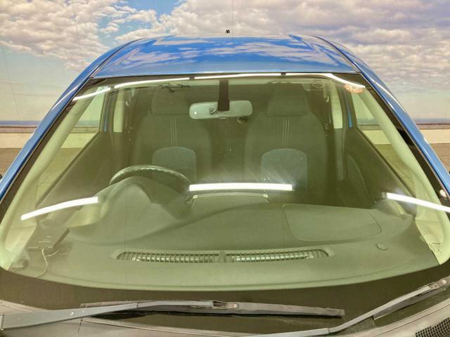 ノート Ｘ　ＦＯＵＲ　夏冬タイヤ付き　エンジンスターター　禁煙　ＥＴＣ　衝突安全ボディ　ワンセグＴＶ　パワーステアリング　ＡＵＸ端子　メモリーナビ付き　切替４ＷＤ　ＤＶＤ再生可（28枚目）