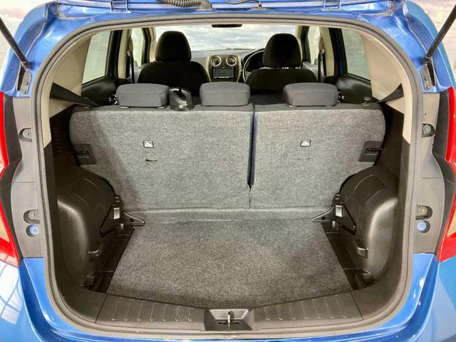 ノート Ｘ　ＦＯＵＲ　夏冬タイヤ付き　エンジンスターター　禁煙　ＥＴＣ　衝突安全ボディ　ワンセグＴＶ　パワーステアリング　ＡＵＸ端子　メモリーナビ付き　切替４ＷＤ　ＤＶＤ再生可（65枚目）