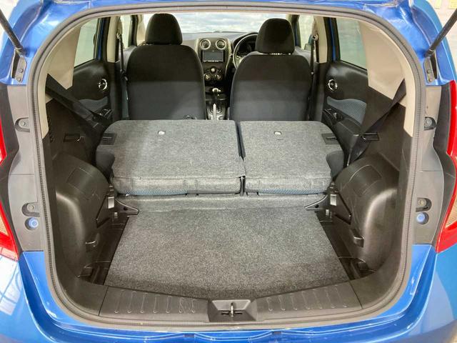 ノート Ｘ　ＦＯＵＲ　夏冬タイヤ付き　エンジンスターター　禁煙　ＥＴＣ　衝突安全ボディ　ワンセグＴＶ　パワーステアリング　ＡＵＸ端子　メモリーナビ付き　切替４ＷＤ　ＤＶＤ再生可（66枚目）