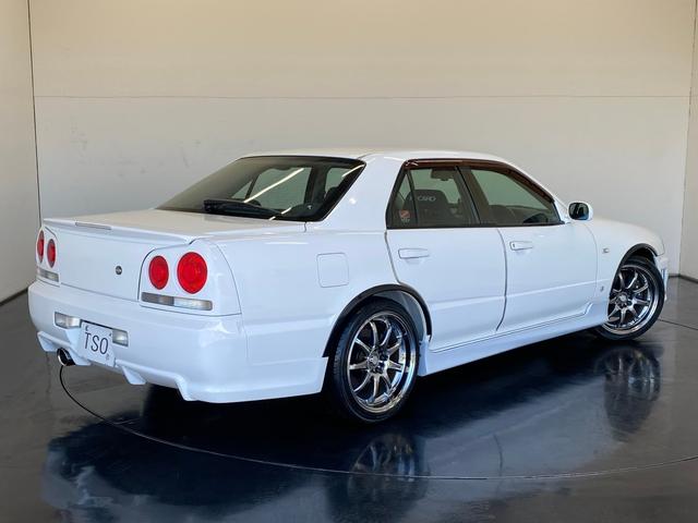 スカイライン 25GT-V 純正MT R34純正アルミボンネット アルティアFバンパー・Sスカート イーストベアーRバンパー・フェンダーモール バッドムーンレーシングマフラー TEIN車高調 WORKホイール フジツボエキマニ(2枚目)