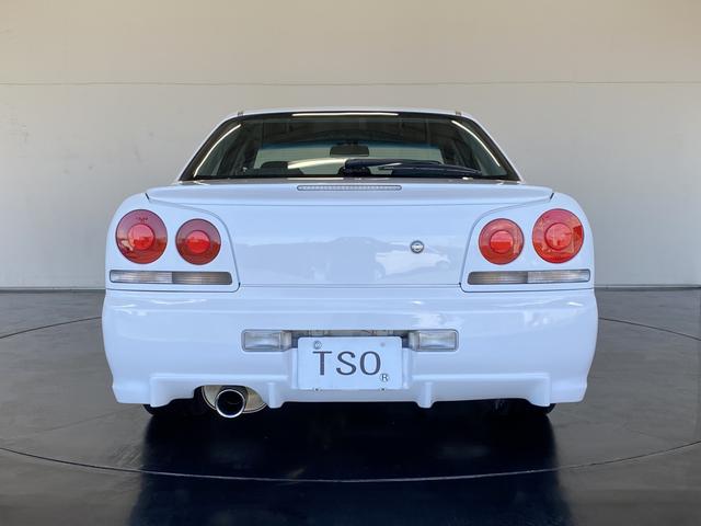 スカイライン 25GT-V 純正MT R34純正アルミボンネット アルティアFバンパー・Sスカート イーストベアーRバンパー・フェンダーモール バッドムーンレーシングマフラー TEIN車高調 WORKホイール フジツボエキマニ(4枚目)