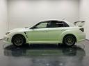 インプレッサ ＷＲＸ　ＳＴｉ　純正ＭＴ　社外フロントフェンダー　社外ヘッドライト　社外テールランプ　社外グリル　社外カーボンリアウイング　ｂｒｅｍｂｏ製対向ブレーキキャリパー　マルチモードＤＣＣＤ　フロントヘリカルＬＳＤ（6枚目）
