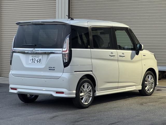 ソリオ ハイブリッドＭＸ　登録済み未使用車／ＥＴＣ２．０／電動スライドドア／衝突被害軽減ブレーキ／レーダークルーズコントロール／前席シートヒーター／後席ロールサンシェード／格納式テーブル／純正１５インチアルミホイール／ＡＨＢ（11枚目）