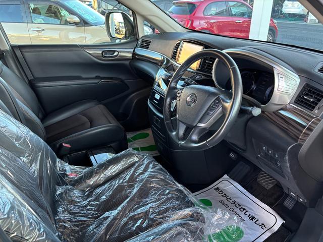 エルグランド ２５０ハイウェイスター　後期型　純正ナビ　フルセグ　走行中ＴＶ視聴可　バックカメラ　純正フリップダウンモニター　両側電動スライドドア　ハーフレザーシート　フロントスポイラーデイライト　オットマン　ドライブレコーダー前後（12枚目）