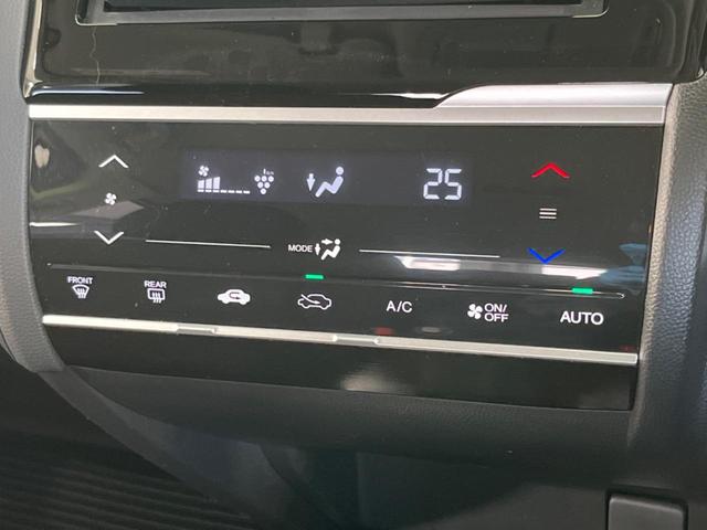 フィットハイブリッド F SDナビ 衝突軽減装置 アダプティブクルーズコントロール 禁煙車 誤発進抑制機能 ETC オートエアコン プッシュスタート&スマートキー 純正15インチスチールホイール 電動格納ドアミラー(32枚目)