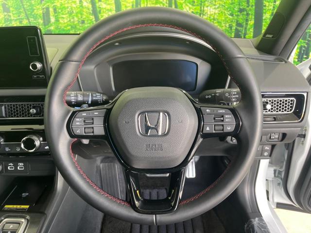 シビック ｅ：ＨＥＶ　メーカー９型ナビ　ＢＯＳＥサウンドシステム　衝突被害軽減システム　アダプティブクルーズ　禁煙車　ドラレコ　ＥＴＣ　Ｂｌｕｅｔｏｏｔｈ　バックカメラ　コーナーセンサー　ＬＥＤヘッド　純正１８インチＡＷ（11枚目）