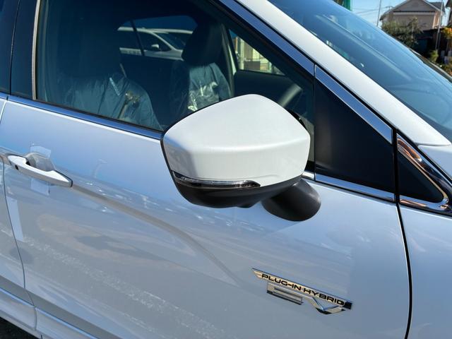 エクリプスクロスＰＨＥＶ Ｐ　４ＷＤ　ルーフレール　スマートフォン連携ナビ　フルセグＴＶ　マルチアラウンドモニター　マイパイロット　ＬＥＤ　Ｐシート　前席後席シートヒーター　ステアリングヒーター　　パワーバックドア　雹凹（25枚目）