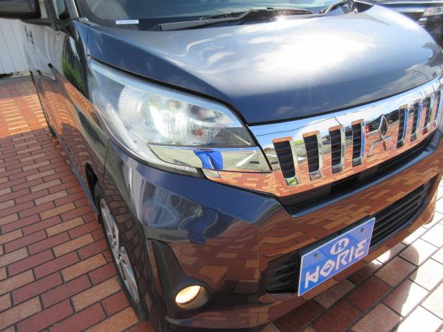 ｅＫスペースカスタム カスタムＴ　純正ナビ／Ｂカメラ／横滑防止／オート付ＨＩＤ＆フォグ／純１５ＡＷ／オート格納ミラー／ウィンカーミラー／インテリキー／プッシュスタート／革巻ステア／ＥＴＣ／ドアバイザー／（58枚目）