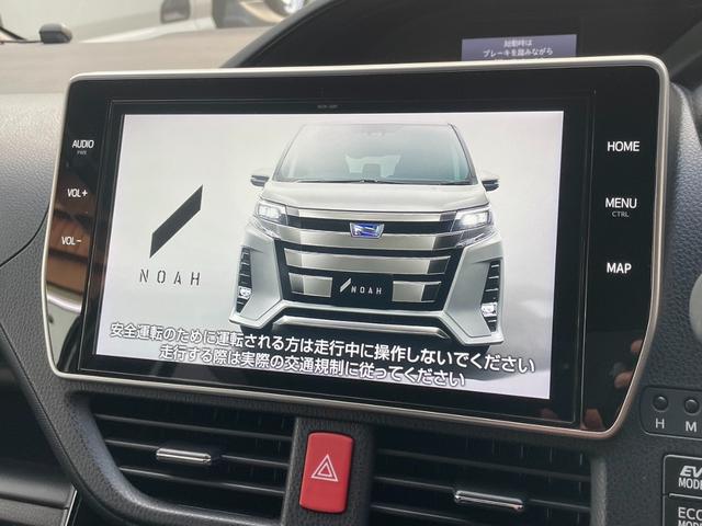 ノア ハイブリッドＳｉ　ダブルバイビーＩＩ　１０型純正ナビ　Ｂカメラ　両側Ｐスライド　衝突軽減Ｂ　シートヒーター　ＥＴＣ２．０　ロールシェード　シートバックテーブル　ワンオーナー　Ａハイビーム（3枚目）