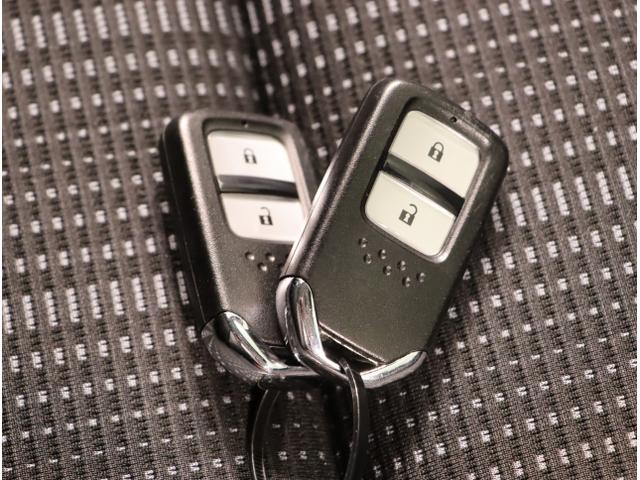 ヴェゼル ハイブリッドZ・ホンダセンシング レーダーサポート DVD再生機能 横滑り防止システム バックアイカメラ 盗難防止装置 フルセ シートヒーター付 スマ-トキ- ECOモード パワーウィンド ナビ&TV(26枚目)