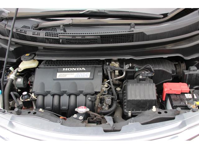 フリードハイブリッド ジャストセレクション 両側パワースライドドア スマートキー 社外アルミホイール ハーフレザーシート HIDヘッドライト フォグランプ クルーズコントロール ETC 横滑り防止装置 電動格納ミラー 純正ナビ バックカメラ(21枚目)