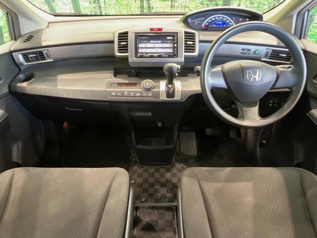 フリード G ジャストセレクション 両側電動ドア 純正HDDナビ バックカメラ 禁煙車 スマートキー HIDヘッド ETC オートライト オートエアコン CD/DVD再生 14インチアルミホイール 電動格納ミラー ドアバイザー(2枚目)