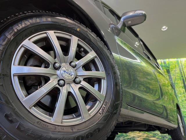 フリード G ジャストセレクション 両側電動ドア 純正HDDナビ バックカメラ 禁煙車 スマートキー HIDヘッド ETC オートライト オートエアコン CD/DVD再生 14インチアルミホイール 電動格納ミラー ドアバイザー(13枚目)