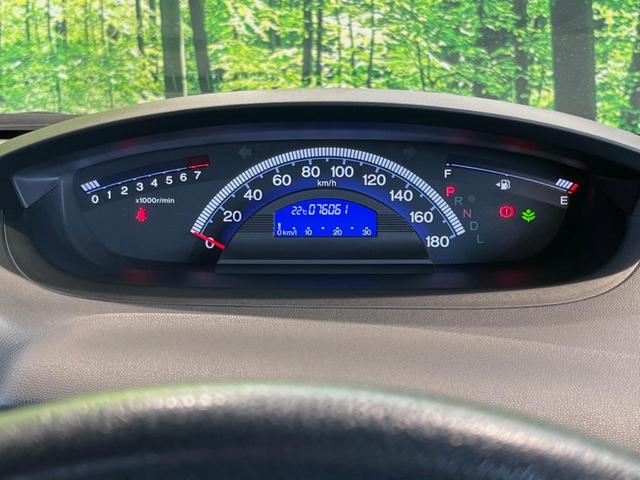 フリード G ジャストセレクション 両側電動ドア 純正HDDナビ バックカメラ 禁煙車 スマートキー HIDヘッド ETC オートライト オートエアコン CD/DVD再生 14インチアルミホイール 電動格納ミラー ドアバイザー(24枚目)