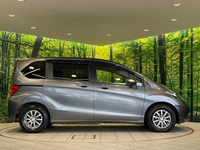 フリード G ジャストセレクション 両側電動ドア 純正HDDナビ バックカメラ 禁煙車 スマートキー HIDヘッド ETC オートライト オートエアコン CD/DVD再生 14インチアルミホイール 電動格納ミラー ドアバイザー(40枚目)