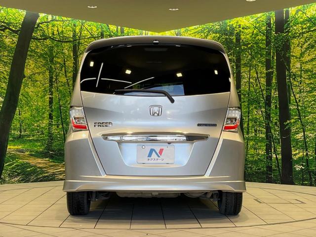 フリードハイブリッド ジャストセレクション　純正９型ナビ　後席モニター　バックカメラ　両側電動ドア　禁煙車　クルコン　ハーフレザーシート　スマートキー　ＨＩＤヘッド　ビルトインＥＴＣ　オートライト　オートエアコン　ＣＤ／ＤＶＤ再生　地デジ（16枚目）